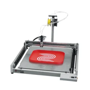 SoliFuse automated channel letter fabrication machine with an open-frame gantry, material reel, precision tool head, and large flat workbed, shown producing a red 3D sign with a white graphic.