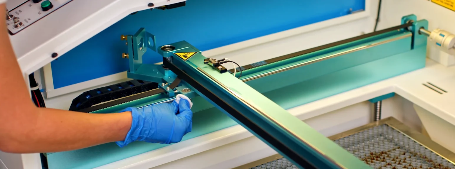 cleaning laser engraving machine rails and bearings during routine maintenance