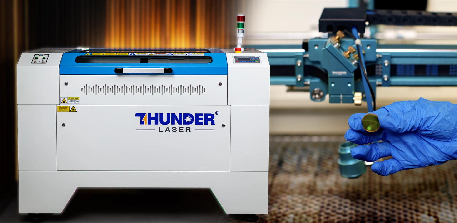 Laser focus lens inspection during routine laser engraving machine maintenance