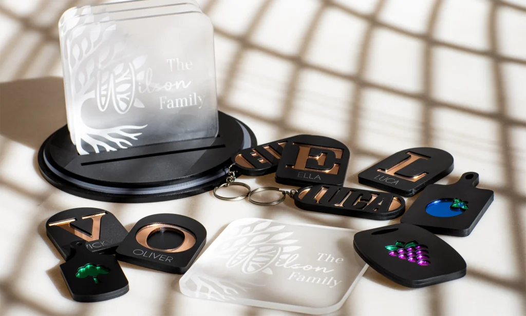 Laser-cut personalised acrylic coasters, name keychains and fridge magnets made with layered acrylic