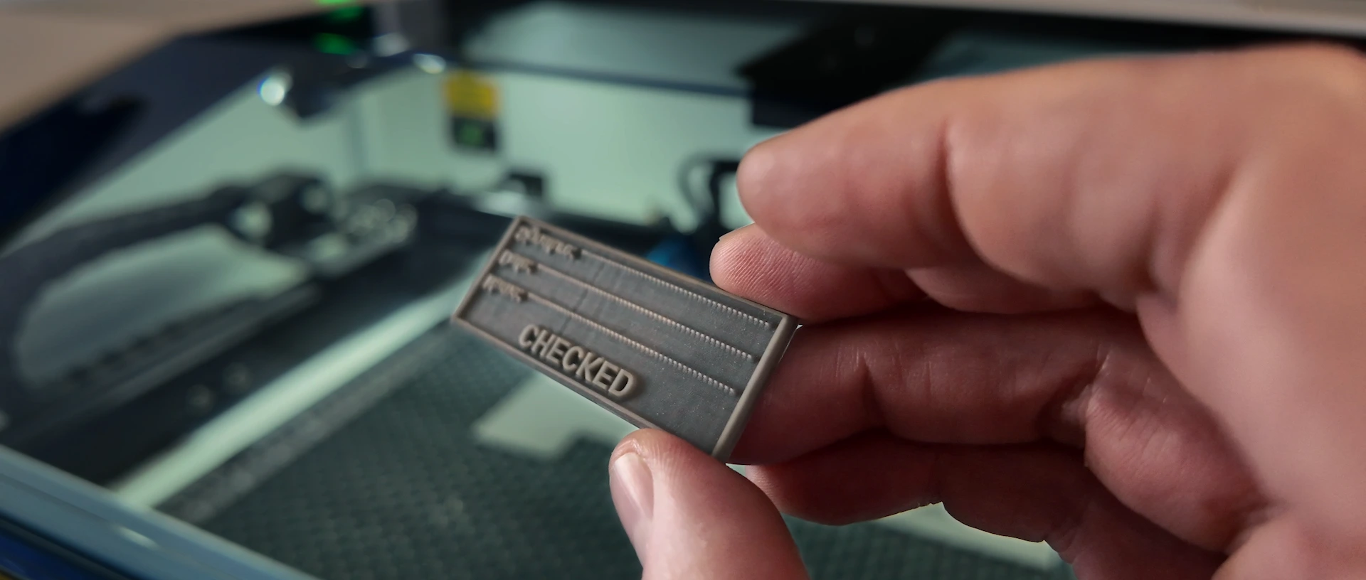 Close-up of fine text on a laser engraved rubber stamp plate